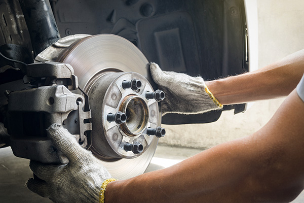 Brake Caliper Service: Why Sticking Calipers Cause Uneven Brakes